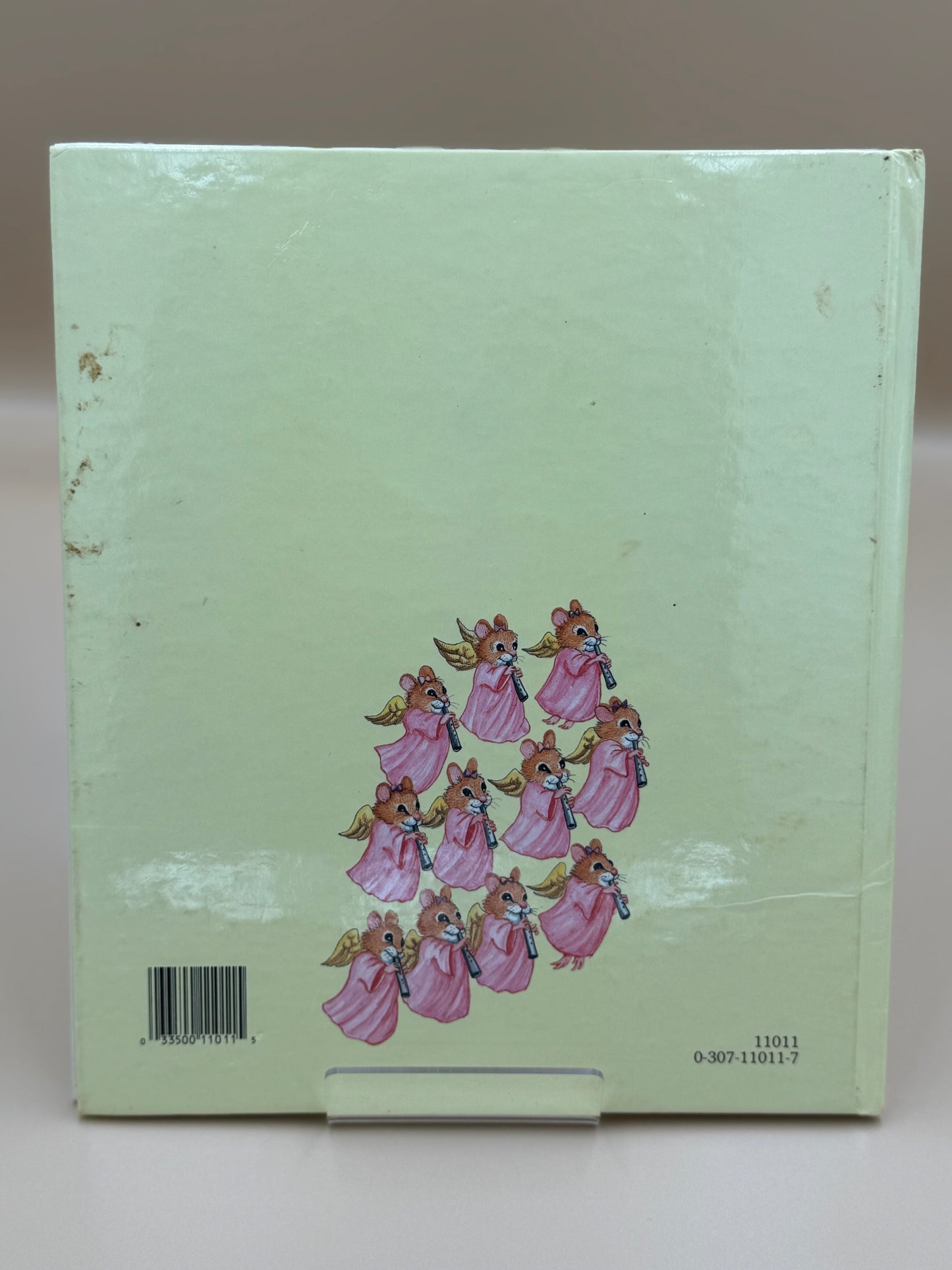 Light green box with angel illustrations on a plain background