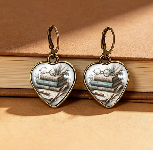 Vintage book lover heart-shaped dangle earrings featuring stacked antique books, reading glasses, flowers and antique bronze-tone leverback closures