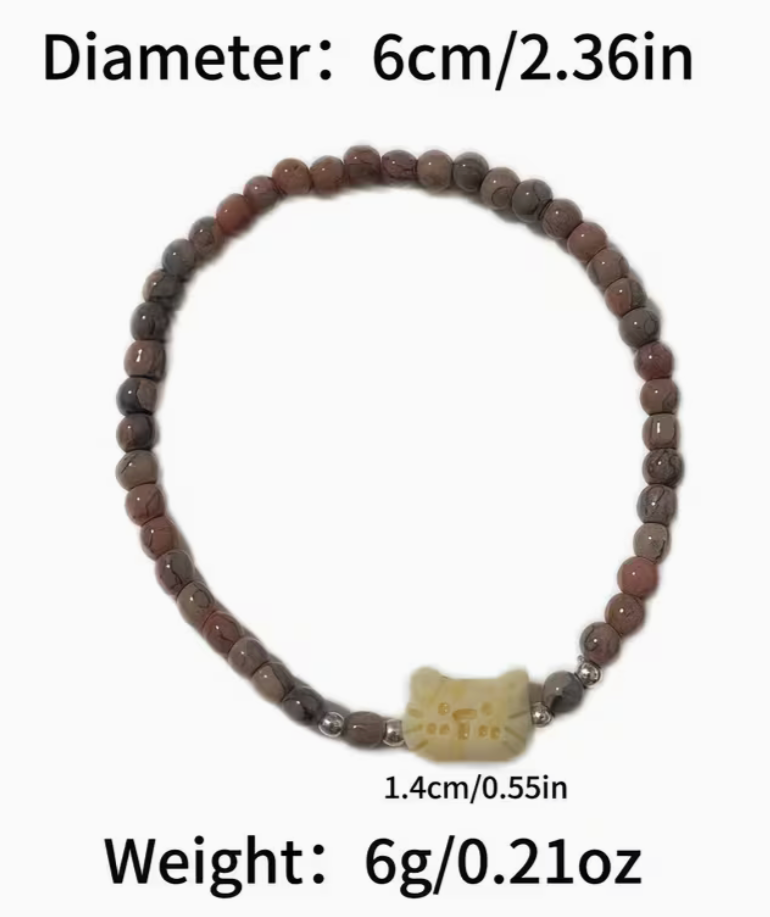 Vintage cat charm stretch bracelet with 6 cm diameter and 1.4 cm cat centerpiece displayed with size details.