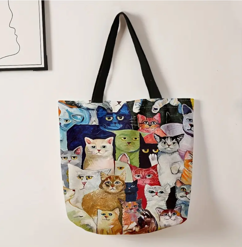Tote bag with colorful cat pattern on a white background