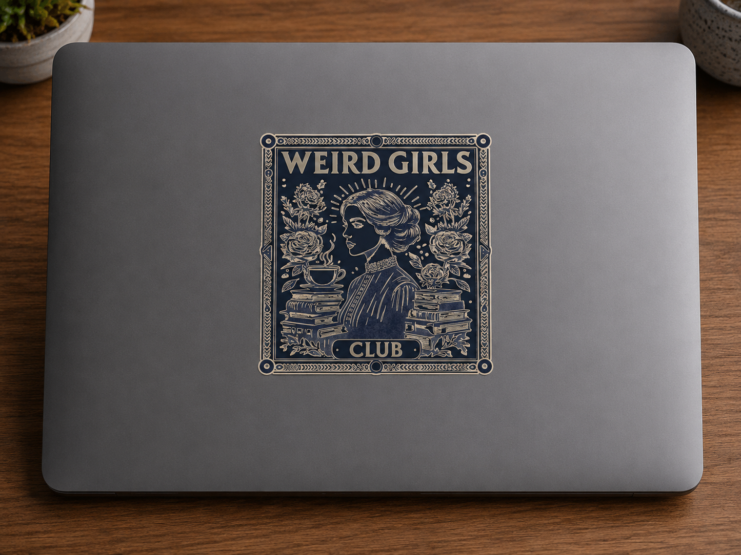 Vintage-inspired Weird Girls Club die cut sticker featuring a literary woman surrounded by books, flowers, and a teacup, displayed on a laptop.