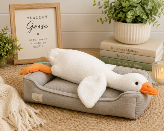 Soft 19-inch white goose plush with crinkle and squeak features, perfect for cuddling, sensory play, and cozy reading companions.