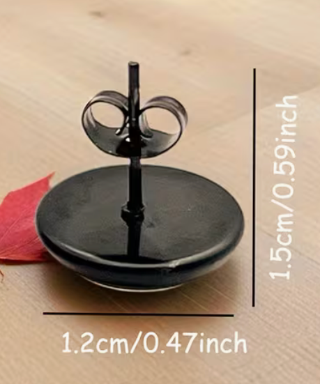 Black round book and wildflower stud earring measuring approximately 0.59 inches tall and 0.47 inches wide