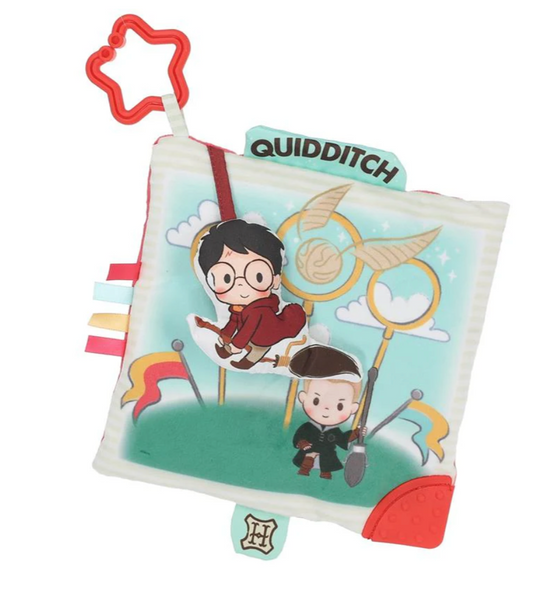 Soft baby crinkle sensory toy square with magical sports theme, featuring flying broom characters, colorful ribbons, and attached star clip for stroller or car seat