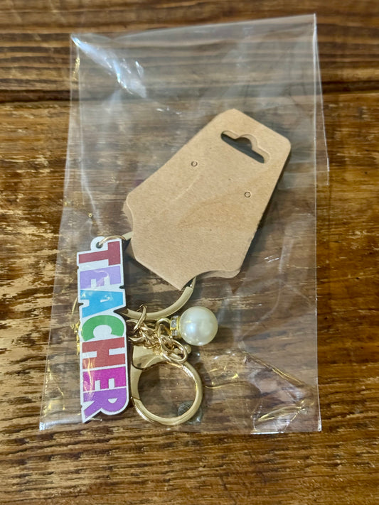 Wooden keychain with the word Teacher engraved in clean, classic lettering—perfect for everyday use and gifting.