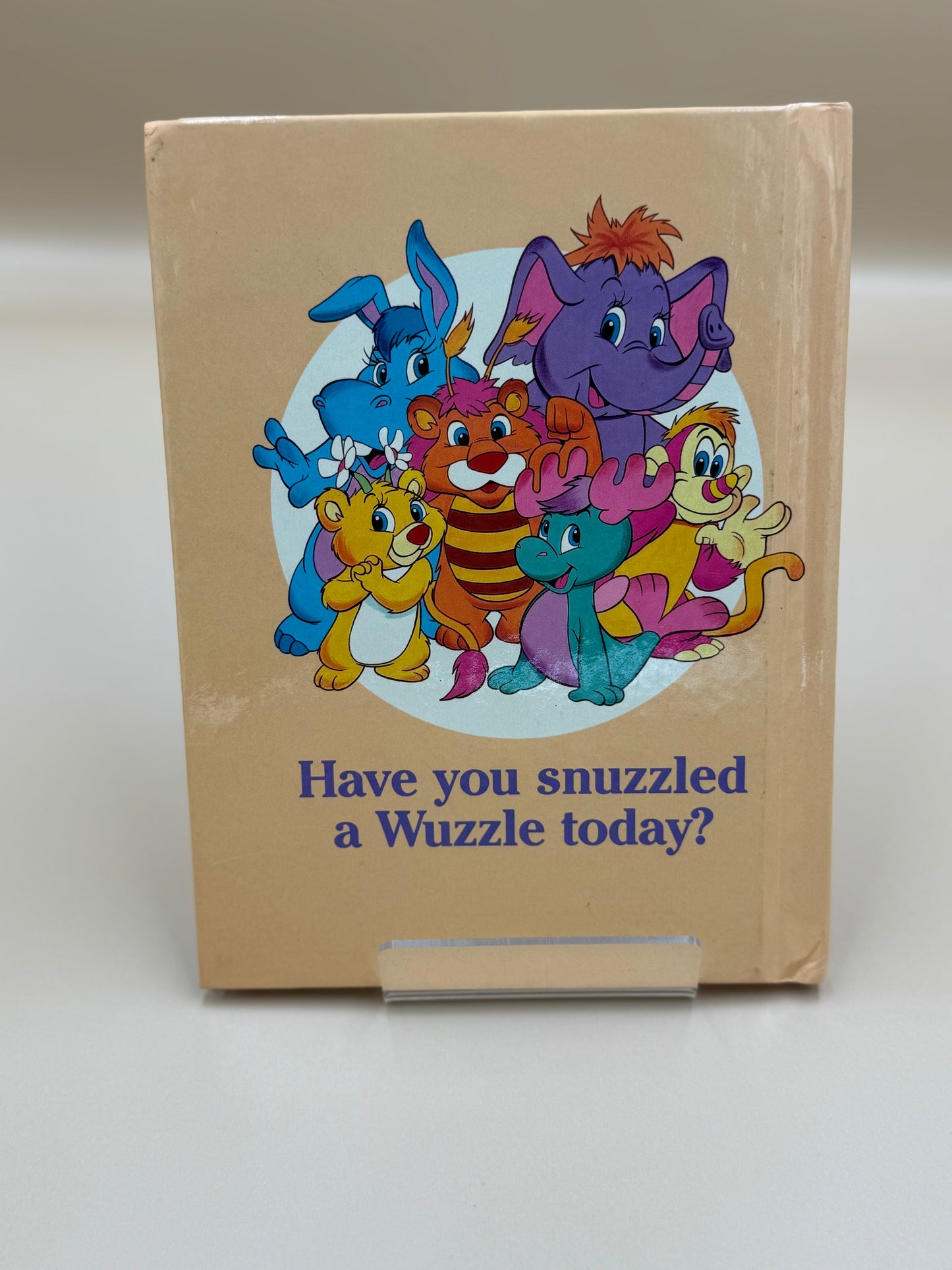 Children's book with colorful animal illustrations and text on a beige background