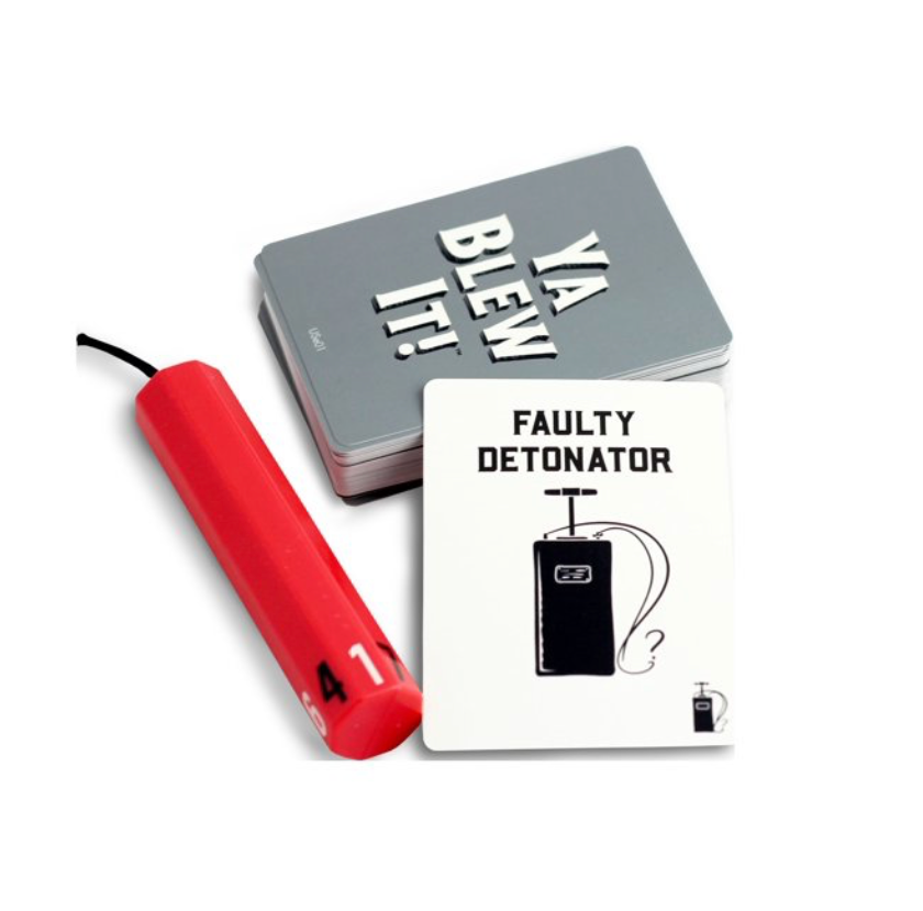 Close-up of Ya Blew It! game cards and red detonator game piece.