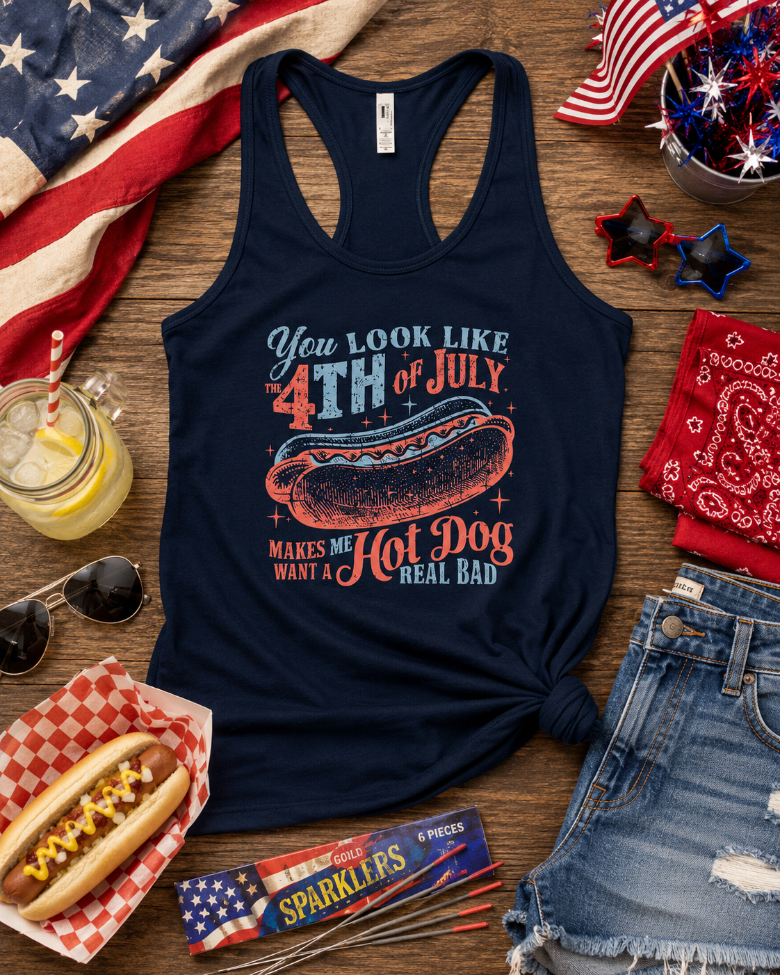 Navy blue women's racerback tank featuring the funny You Look Like the 4th of July Makes Me Want a Hot Dog Real Bad patriotic hot dog graphic.