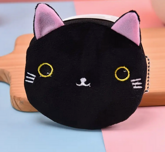 Black cat-shaped plush coin purse with pink ears on a colorful background